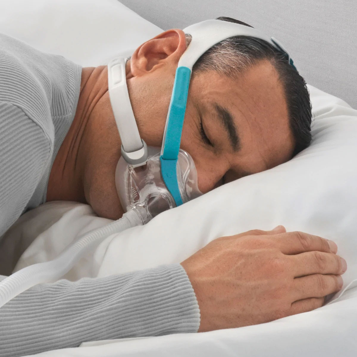 Should I use my CPAP when I have a cold? F&P Evora Full Face Mask - Man on Pillow