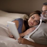 CPAP Therapy user in bed | Intus Healthcare