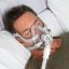 Man wearing ResMed AirFit F40 in bed | Intus Healthcare