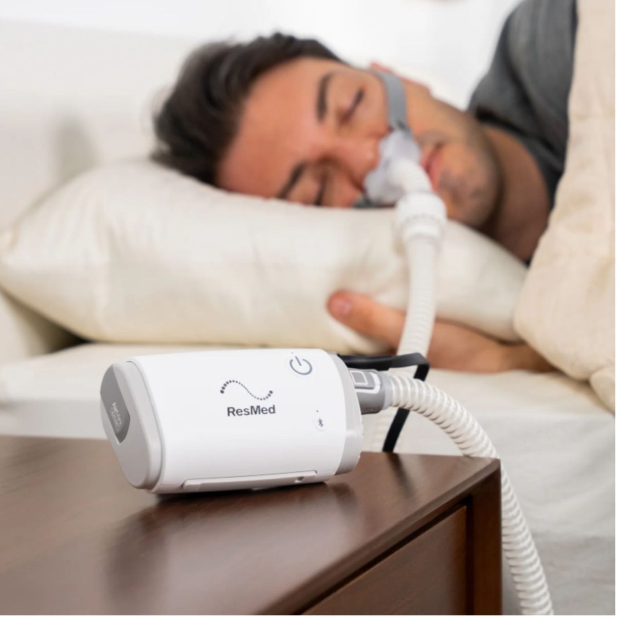 ResMed AirMini CPAP Machine on bedside table | Intus Healthcare
