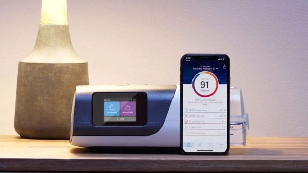 Bedside table with ResMed AirSense 11 CPAP Machine and ResMed myAir app on iphone | Intus Healthcare