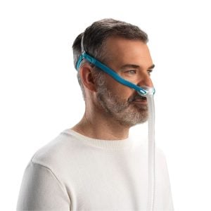 Side profile of man wearing the Fisher and Paykel Nova Micro Nasal Pillows CPAP Mask | Intus Healthcare